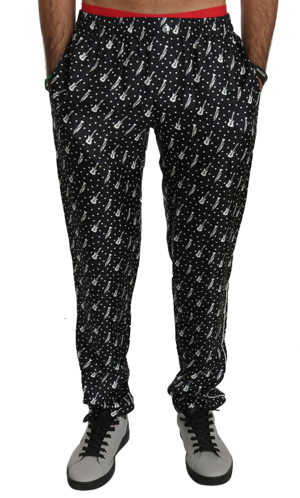 Elegantes pantalones de seda con estampado de instrumentos negros de instrumento negro