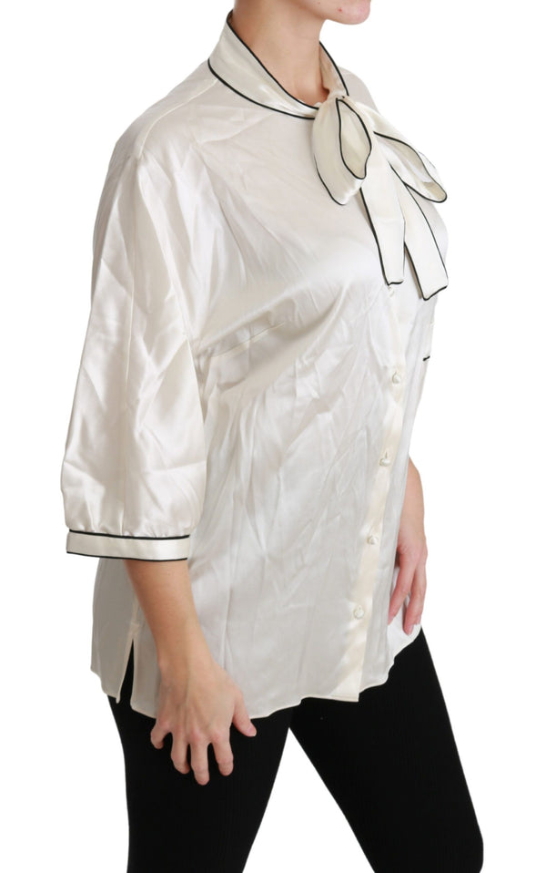 Elegante blusa de seda beige con bufanda de arco