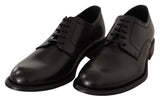 Elegantes zapatos de derby formales de cuero negro