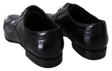 Elegantes zapatos de derby formales de cuero negro