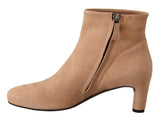 Elegantes botas de cuero beige