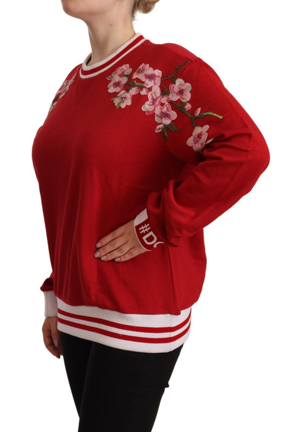 Elegante jersey de cuello redondo rojo con motivo floral