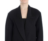 Elegante cappotto lungo drappeggiato in nero con accenti rossi