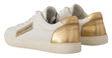 Elegantes zapatillas de cuero blanco con acentos de oro