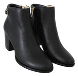 Elegantes botas de tacón de cuero negro