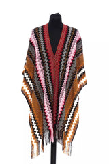 Elegante poncho geometrico con frange