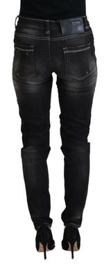 Elegantes jeans negros cónicos de cintura mid