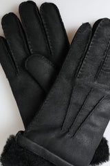 Elegantes guantes de invierno de cuero negro