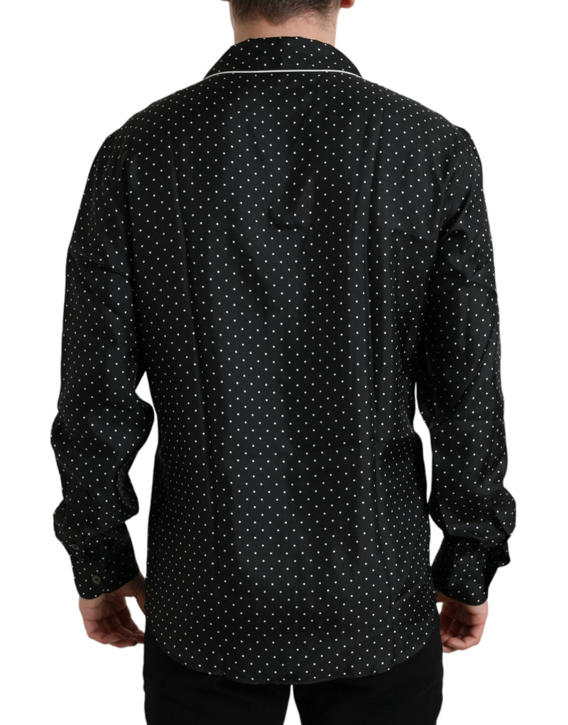 Camicia a maniche lunghe a pois nero.