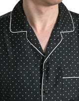 Camicia a maniche lunghe a pois nero.