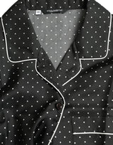 Camicia a maniche lunghe a pois nero.