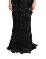 Elegante abito maxi nero con applique floreale