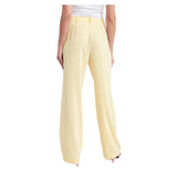 Elegantes pantalones de tela lisa en amarillo