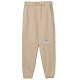 Pantalones de chándal de algodón beige elegantes con detalles deshilachados