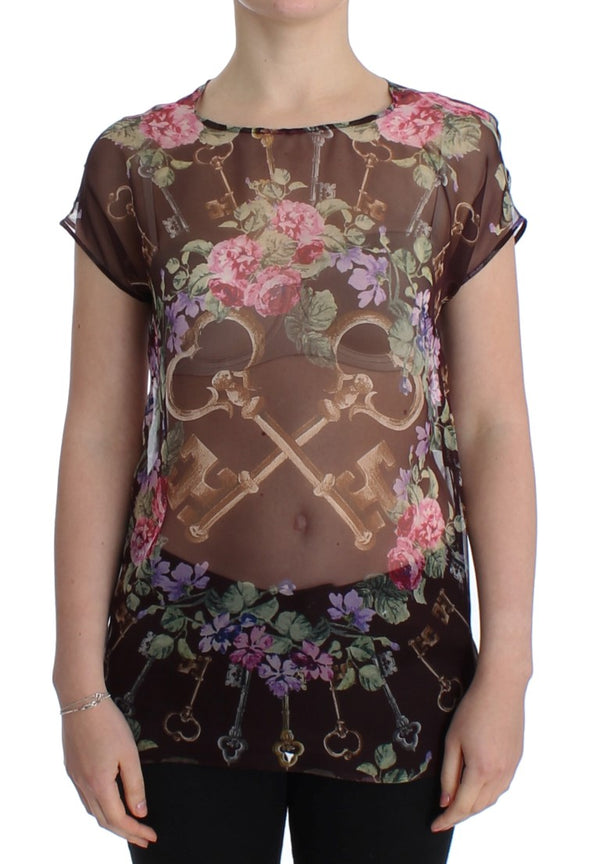 Elegante blusa de seda floral con mangas de tapa