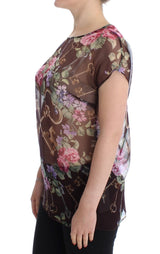 Elegante blusa de seda floral con mangas de tapa