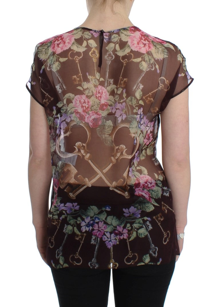 Elegante blusa de seda floral con mangas de tapa