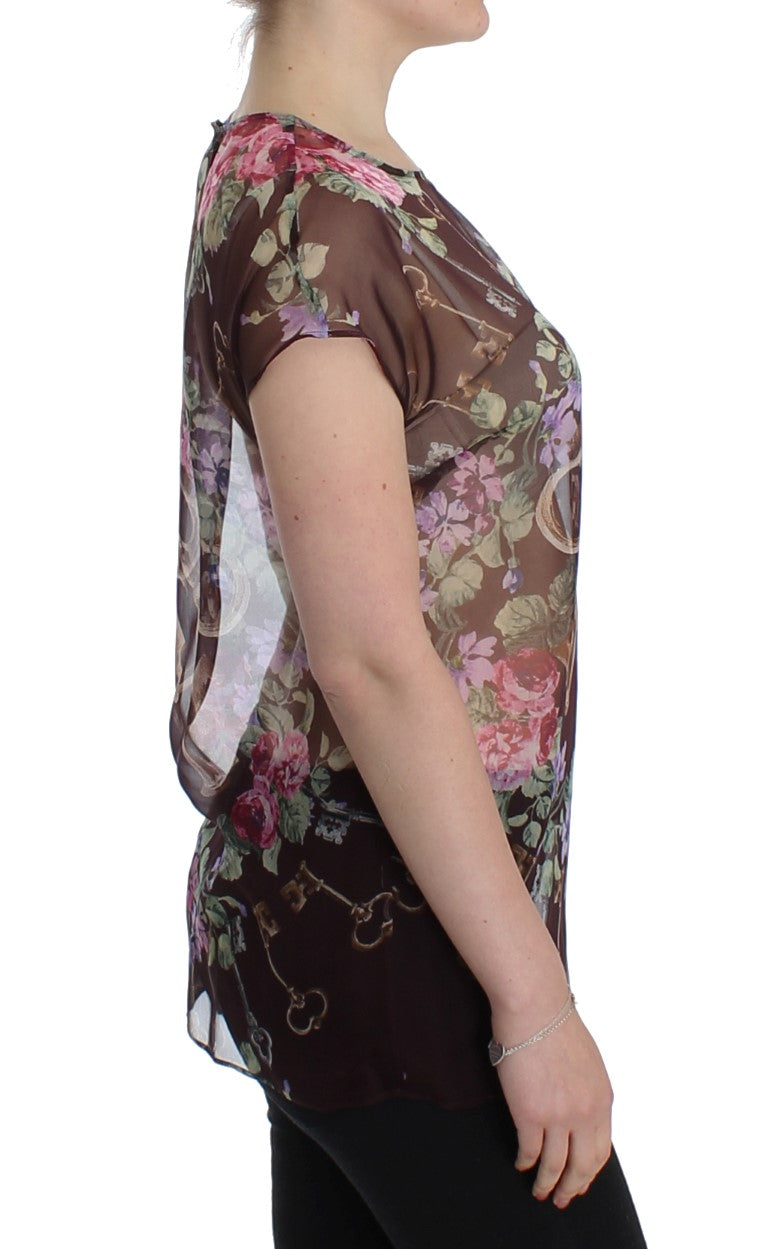 Elegante blusa de seda floral con mangas de tapa