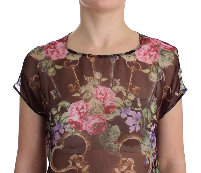 Elegante blusa de seda floral con mangas de tapa