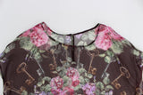 Elegante blusa de seda floral con mangas de tapa