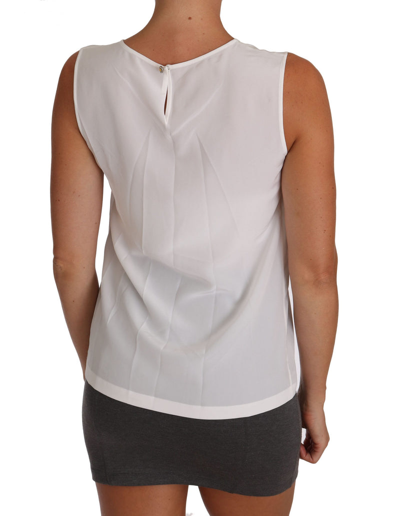 Elegante blusa de seda blanca sin mangas