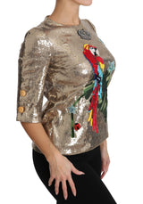 Gold Parrot Motif Neweck Blouse con cristales